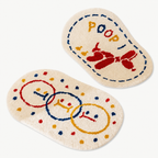 Set of two cream cartoon bath mats